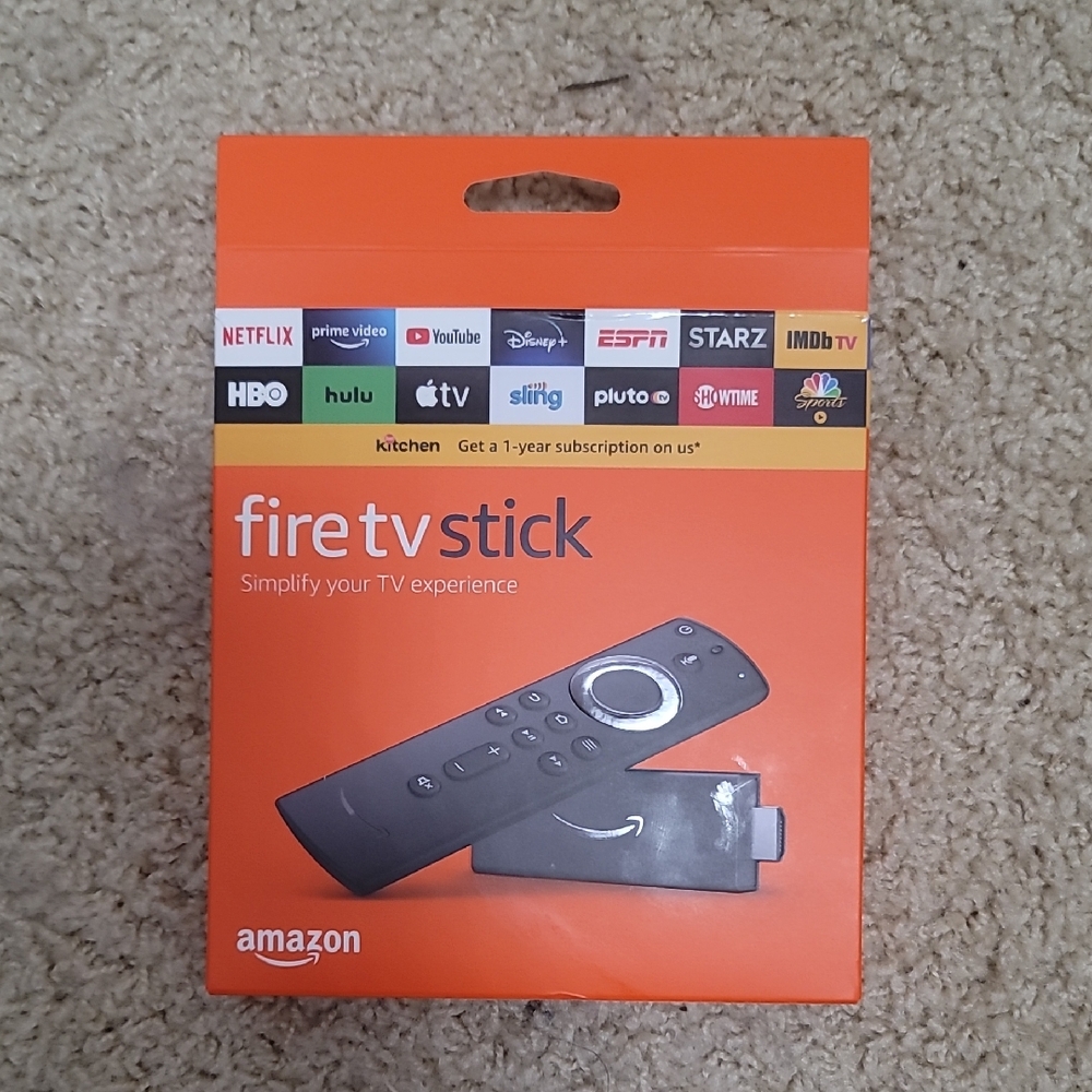 Amazon Fire TV Stick with Remote in Orange Box